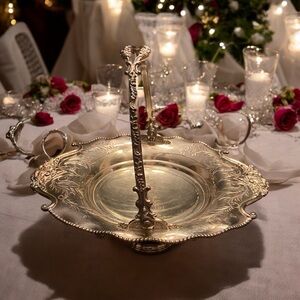 Antique Quadruple Silver Plate Basket with Handle and paw feet.
